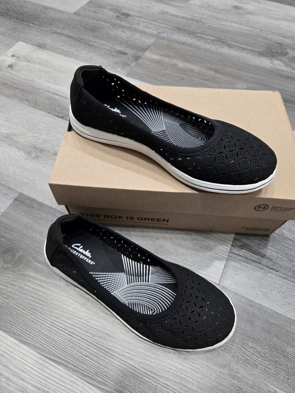Clarks Cloudsteppers Breeze Roam Perfed flats featuring a breathable textile